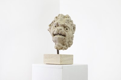 Lot 256 - A carved stone head