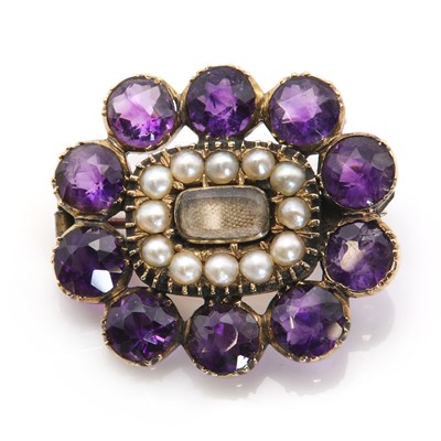 Lot 3 - A Georgian amethyst and split pearl memorial brooch