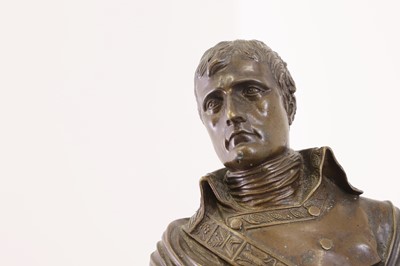 Lot 335 - A small patinated bronze bust of Napoleon