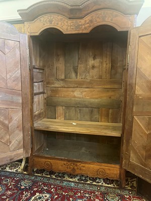 Lot 459 - A Louis XV provincial chestnut armoire