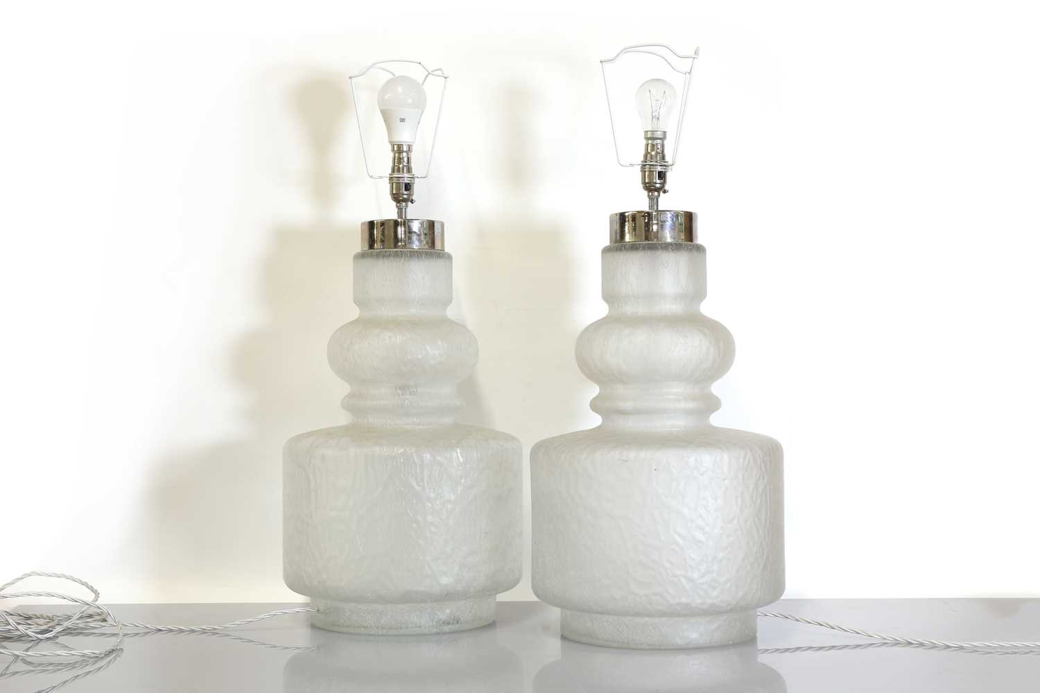Lot 262 - A pair of moulded glass table lamps