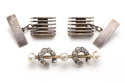 Lot 269 - A gold diamond and pearl double horseshoe bar brooch