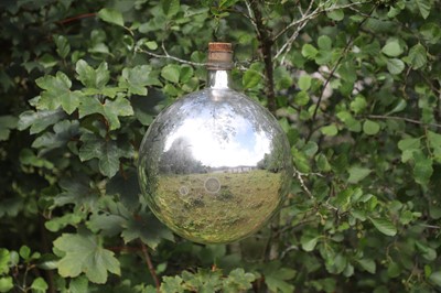 Lot 29 - A mirrored-glass carboy