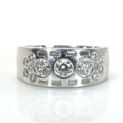 Lot 222 - A contemporary 18ct white gold and diamond band ring