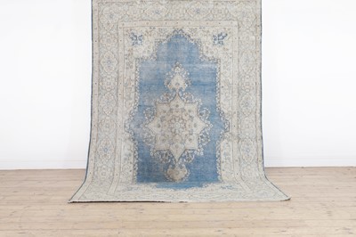 Lot 454 - A wool rug of antique Persian design