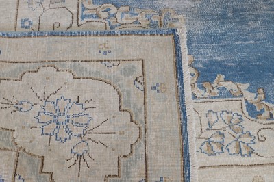 Lot 454 - A wool rug of antique Persian design