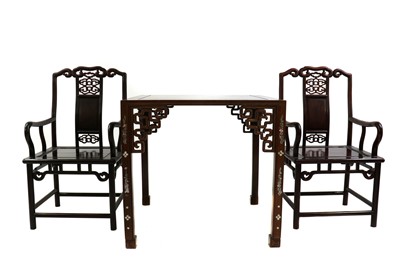 Lot 423 - A pair of Chinese hardwood chairs