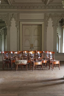 Lot 61 - ☘ A composed set of fourteen Biedermeier walnut dining chairs