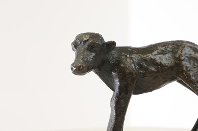 Lot 364 - A small patinated bronze figure