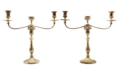 Lot 96 - A pair of silver candlesticks