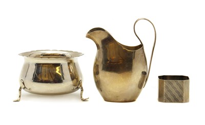 Lot 72 - A silver cream jug, bowl and napkin ring