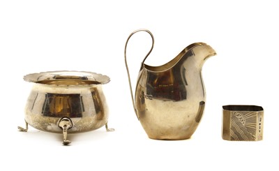 Lot 72 - A silver cream jug, bowl and napkin ring