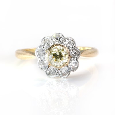 Lot 111 - A coloured diamond flowerhead cluster ring