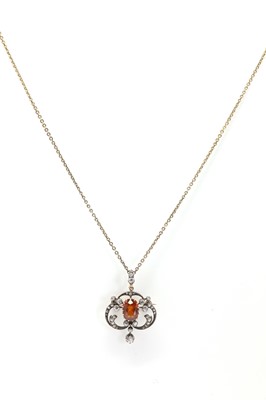 Lot 25 - A late Victorian hessonite garnet and diamond pendant/brooch