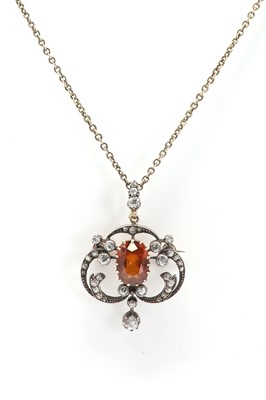 Lot 25 - A late Victorian hessonite garnet and diamond pendant/brooch
