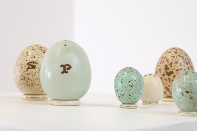 Lot 368 - A suite of porcelain salt and pepper shakers by James McIntyre