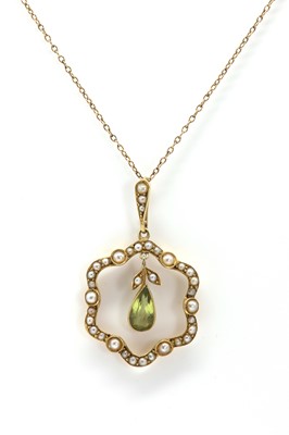 Lot 28 - An Edwardian peridot and seed pearl pendant by Murrle Bennett & Co.