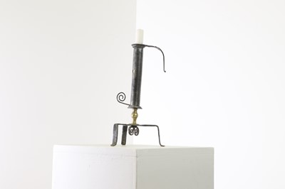 Lot 360 - An iron and brass candlestick