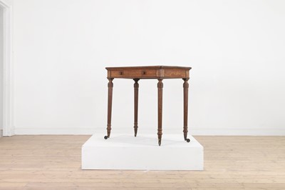 Lot 404 - An oak writing table by Holland & Sons