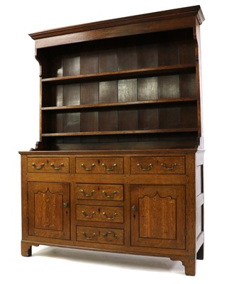 Lot 390 - A late George III oak dresser