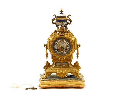 Lot 258 - A French gilt metal and porcelain mantel clock