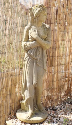 Lot 512 - A reconstituted stone garden statue