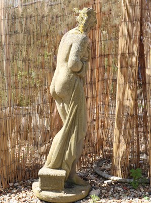 Lot 512 - A reconstituted stone garden statue