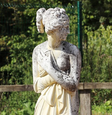 Lot 512 - A reconstituted stone garden statue