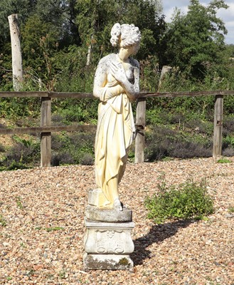 Lot 512 - A reconstituted stone garden statue
