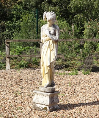 Lot 512 - A reconstituted stone garden statue