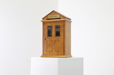 Lot 509 - A golden oak letter box