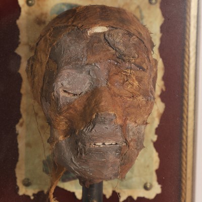 Lot 58 - A replica Egyptian mummy's head