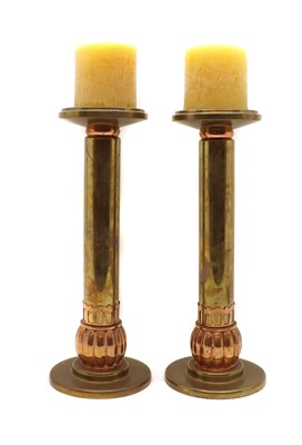 Lot 329 - A pair of brass and copper candlesticks