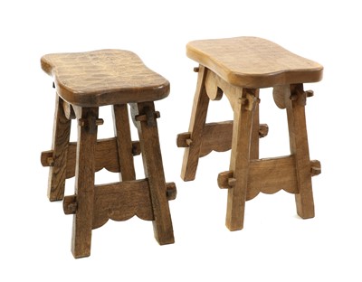 Lot 397 - A pair of adzed oak occasional tables