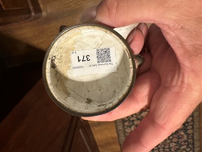 Lot 371 - ☘ An enamel tea caddy