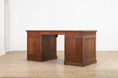 Lot 204 - A Victorian oak twin-pedestal desk in the George II taste