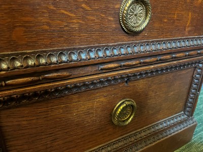 Lot 204 - A Victorian oak twin-pedestal desk in the George II taste