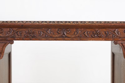 Lot 204 - A Victorian oak twin-pedestal desk in the George II taste