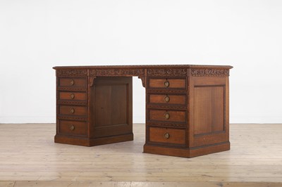 Lot 204 - A Victorian oak twin-pedestal desk in the George II taste