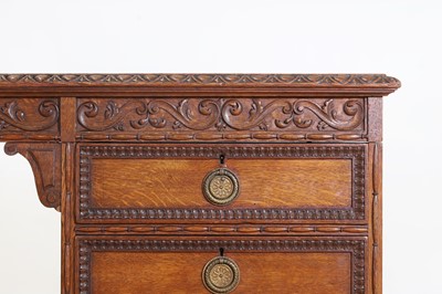 Lot 204 - A Victorian oak twin-pedestal desk in the George II taste