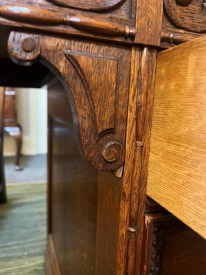 Lot 204 - A Victorian oak twin-pedestal desk in the George II taste