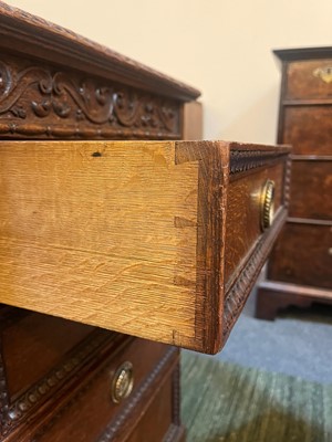 Lot 204 - A Victorian oak twin-pedestal desk in the George II taste