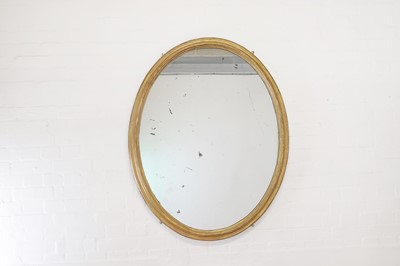 Lot 484 - A giltwood oval mirror