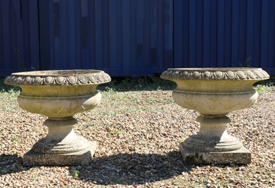 Lot 472 - A pair of composite stone urns