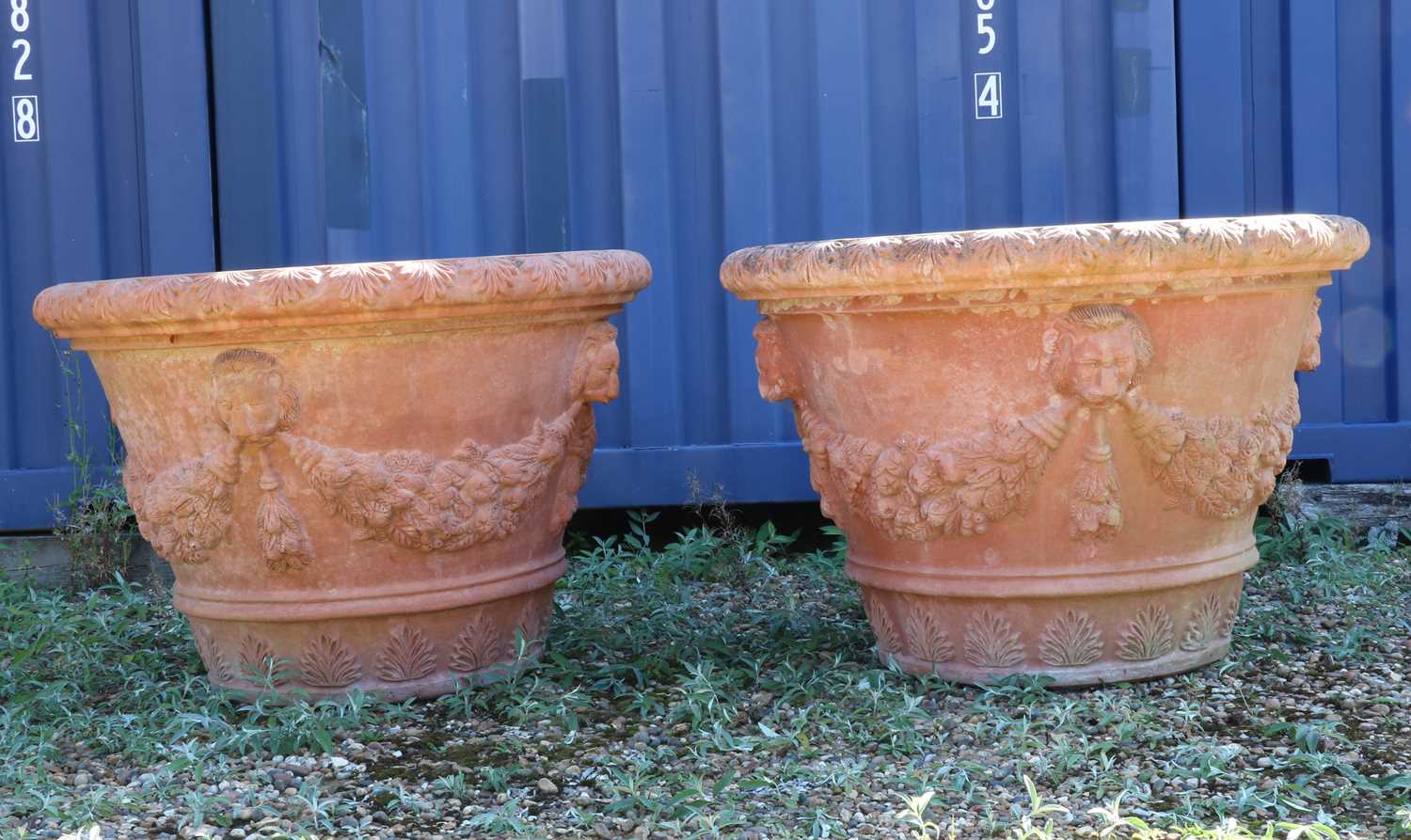 Lot 480 - A large pair of Italian terracotta garden urns