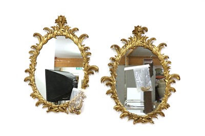 Lot 485 - A pair of giltwood oval mirrors in the style of William and John Linnell