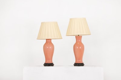Lot 175 - A pair of pink porcelain table lamps