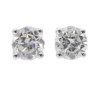 Lot 178 - A pair of single stone diamond stud earrings