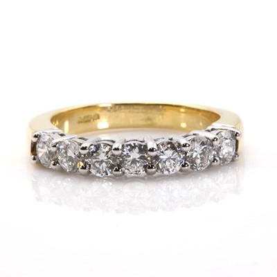 Lot 99 - An 18ct gold diamond set half eternity ring