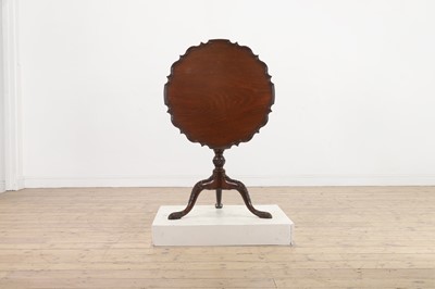Lot 130 - A George III-style carved mahogany tripod table